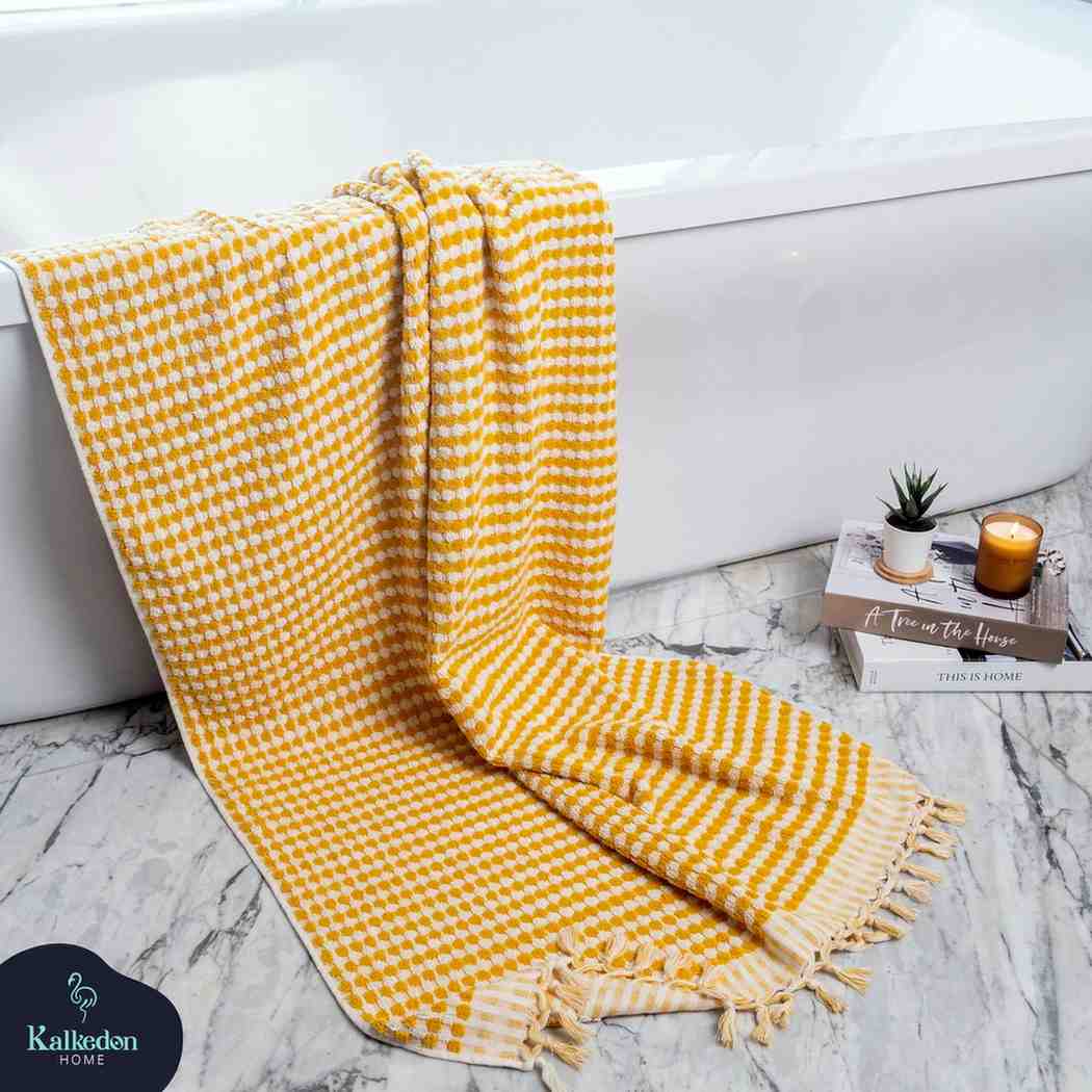 mustard pom pom bath towel
