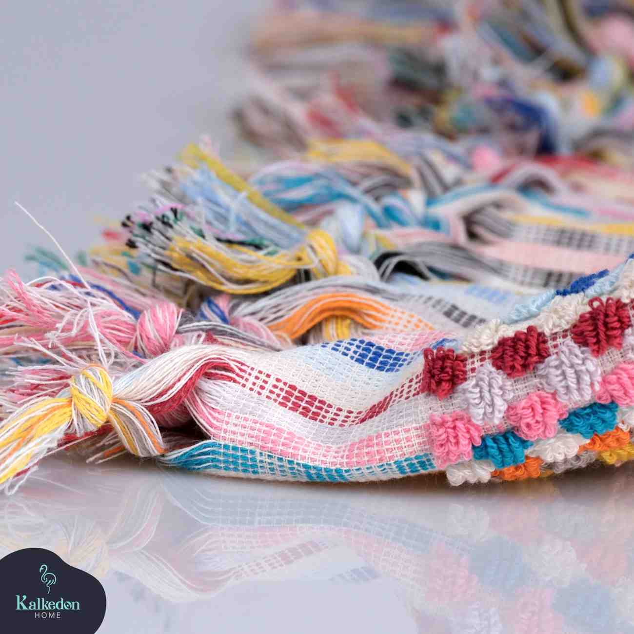 rainbow pom pom bath towel close up