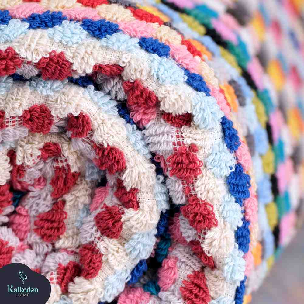 rainbow pom pom bath towel folded close