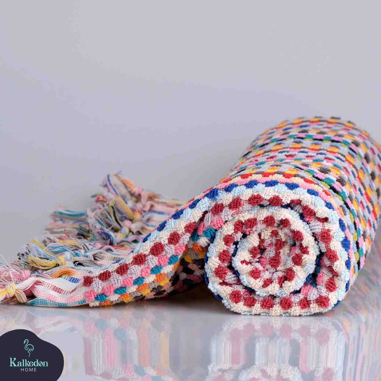 rainbow pom pom bath towel folded