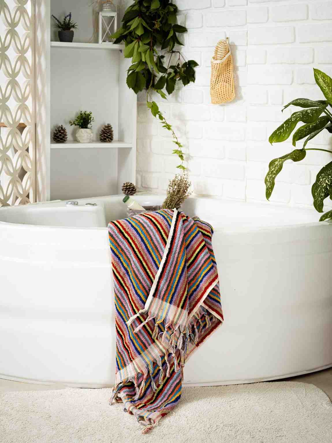 Luxuriously soft and fluffy striped bath towel with thick, plush texture for spa-like comfort