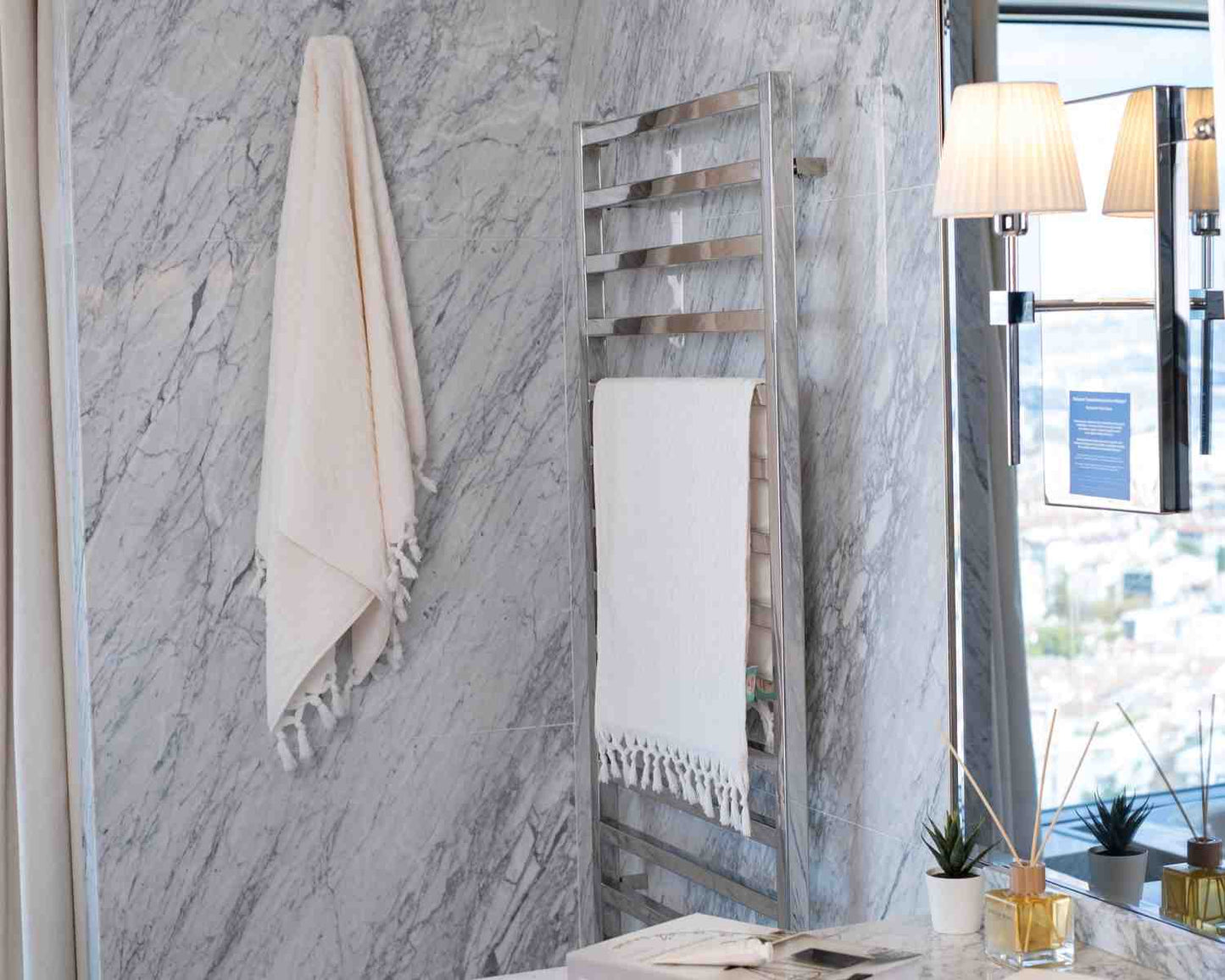 white kumsal towel set hanged bathroom